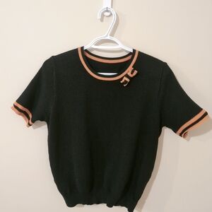 Stylish Black Sweater with Orange Accents